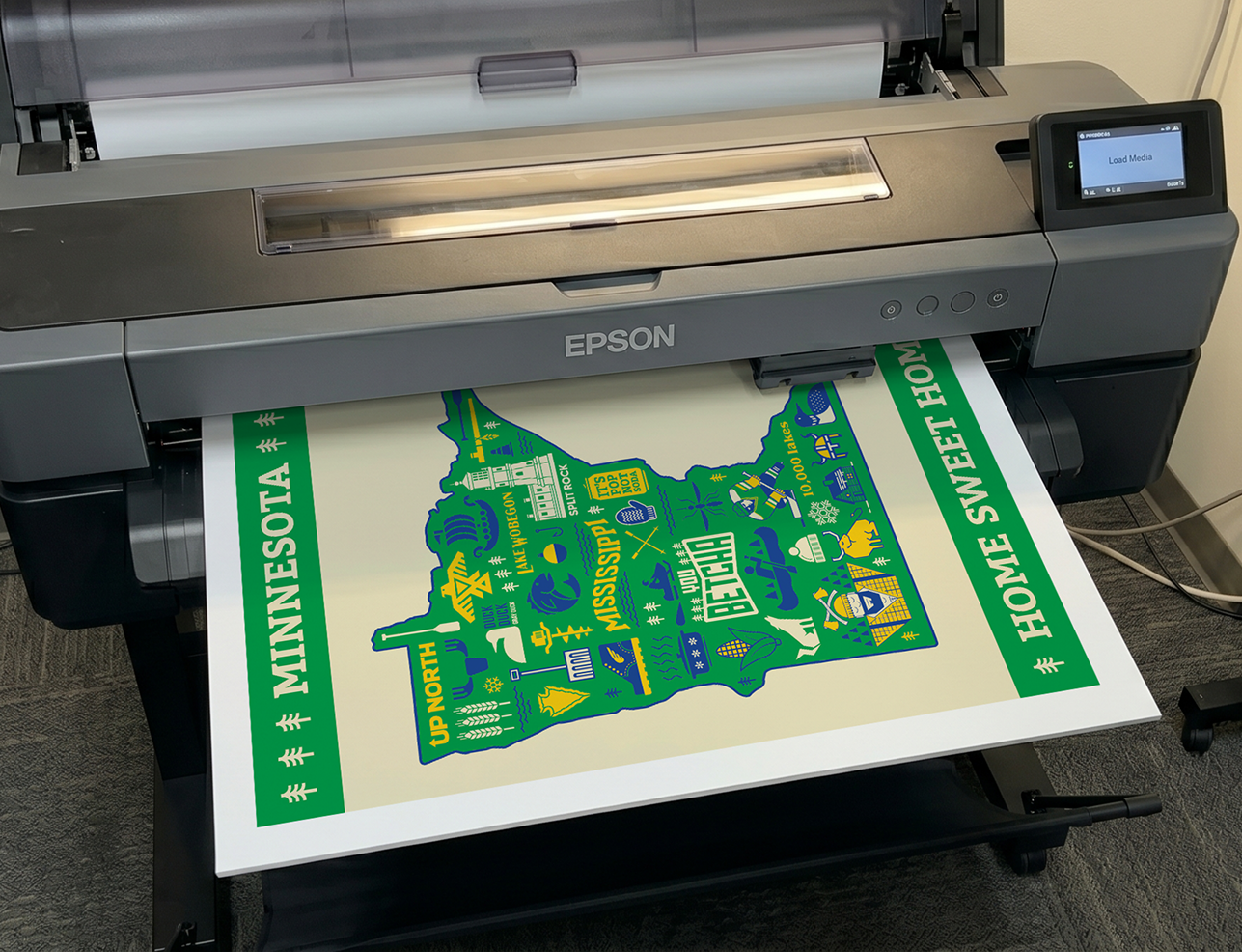 The Minnesota Icons poster coming out of a printer