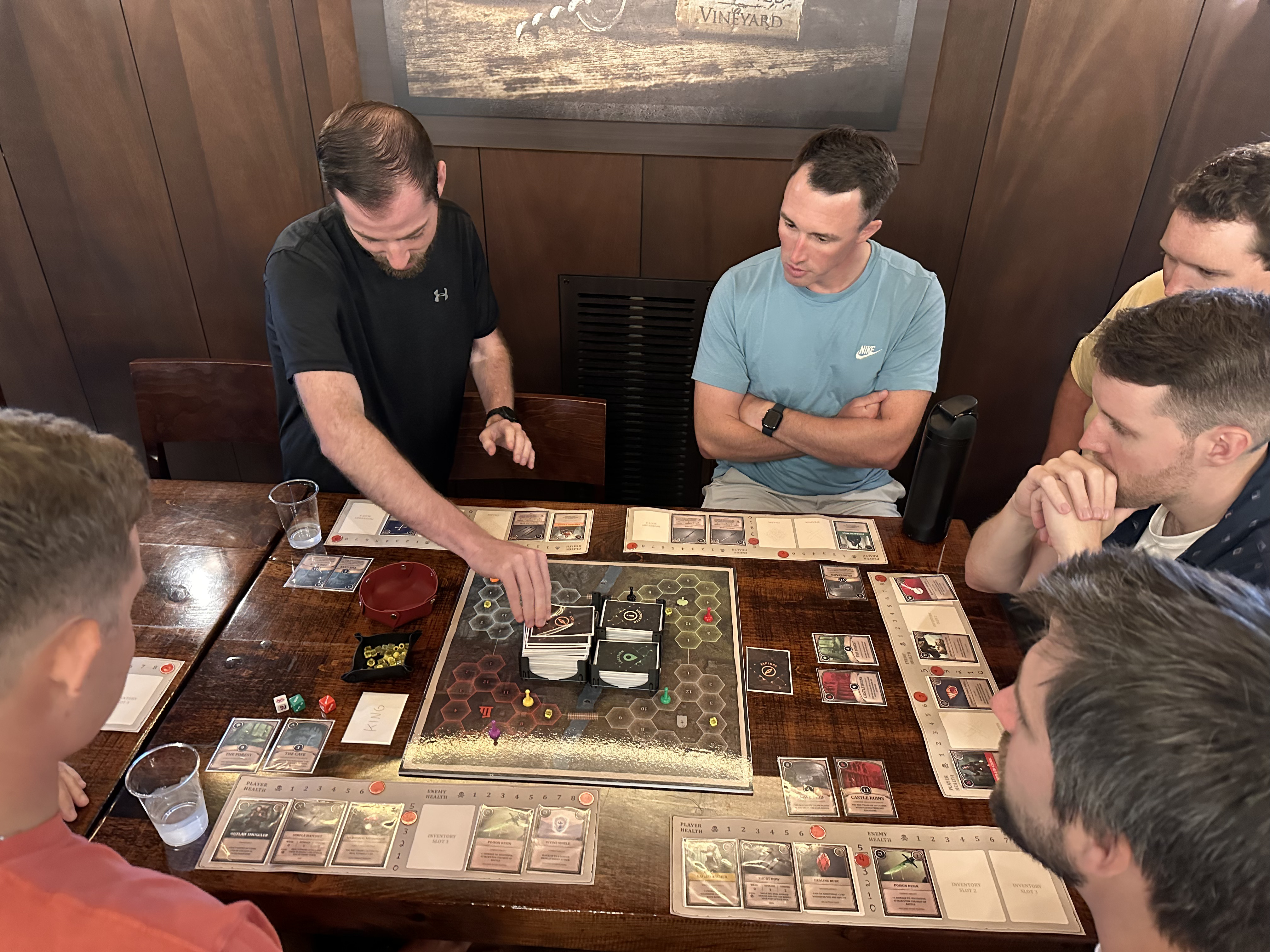 Players gathered around the Reclaim the Realm board